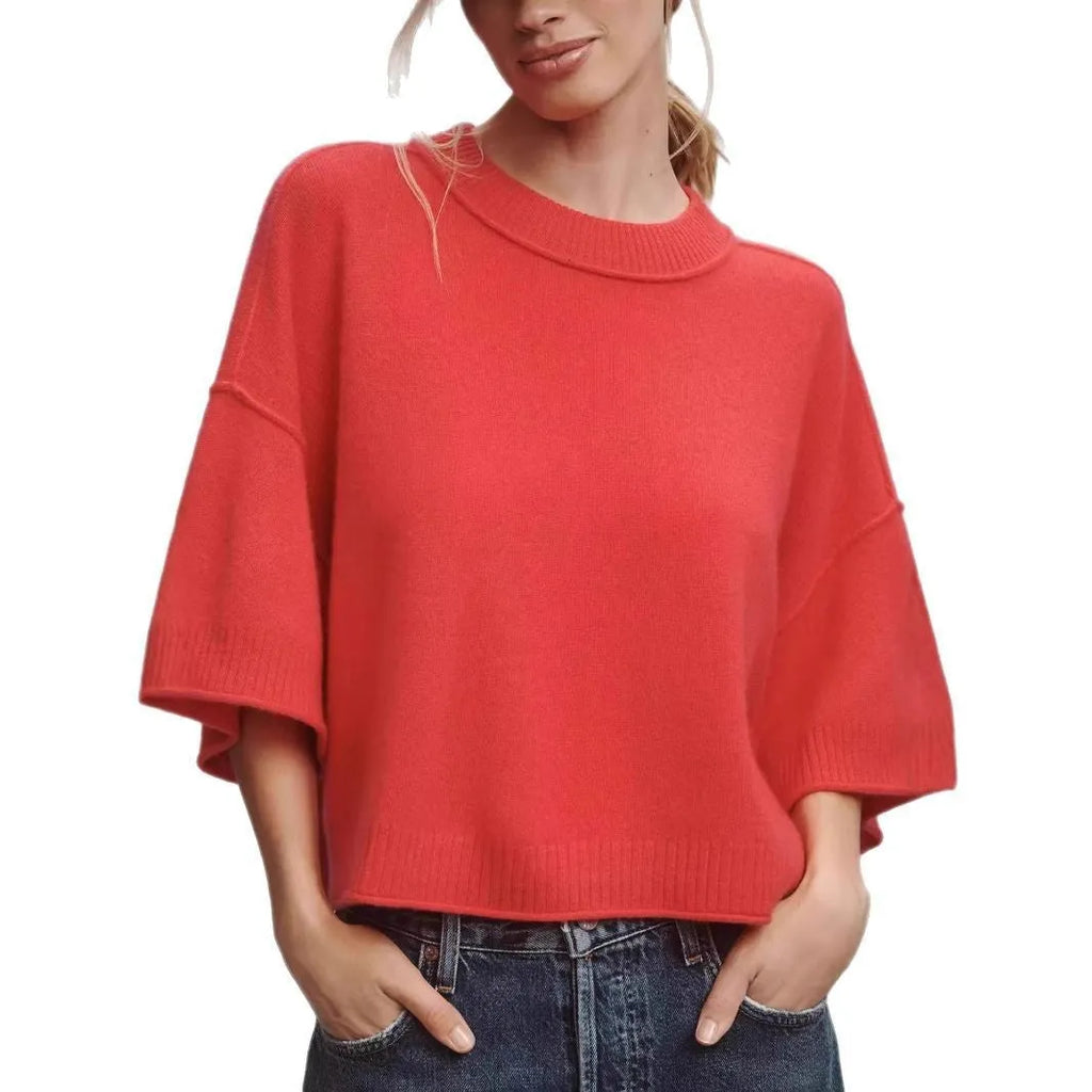 Red cropped women's t-shirt with regular sleeves and exposed navel styling on mannequin