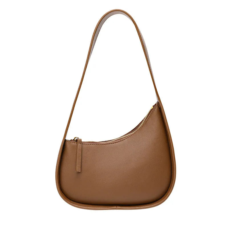 Genuine leather half moon shaped women's shoulder bag with wide strap in caramel colour