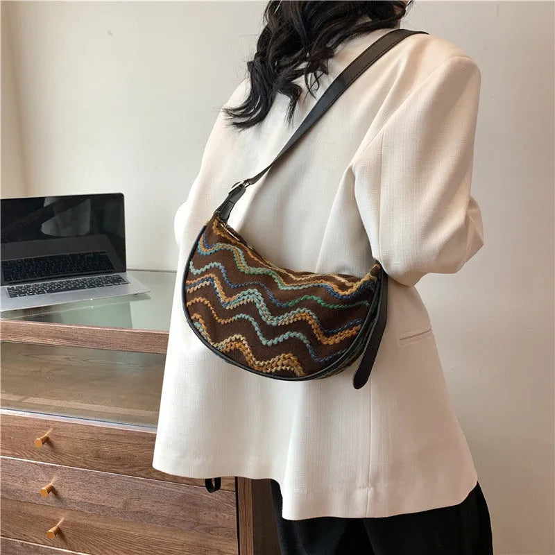 Women's woven straw crossbody bag with internal phone compartment and file storage