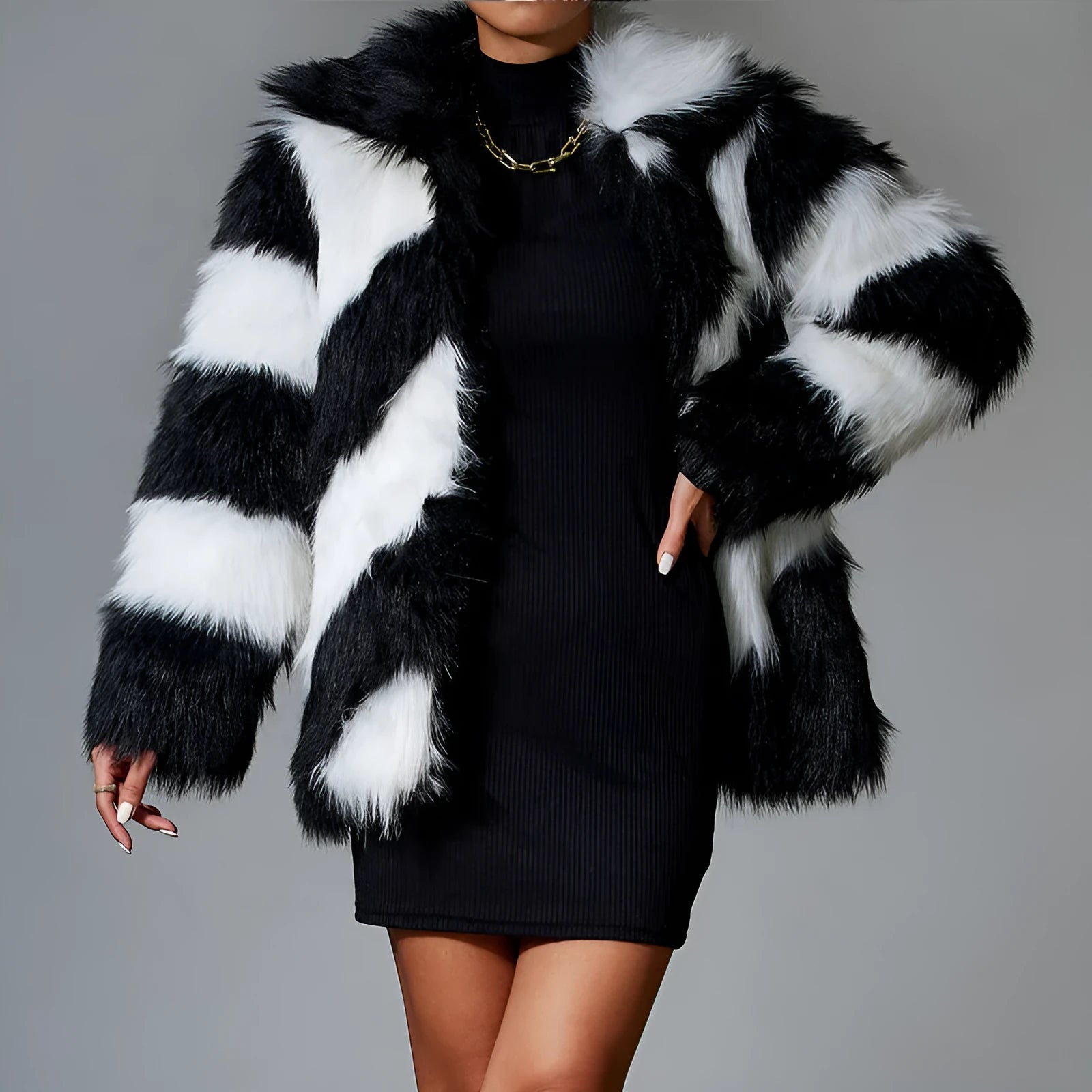 Minimalist faux fur coat with a contrasting colour lapel and a fur collar.