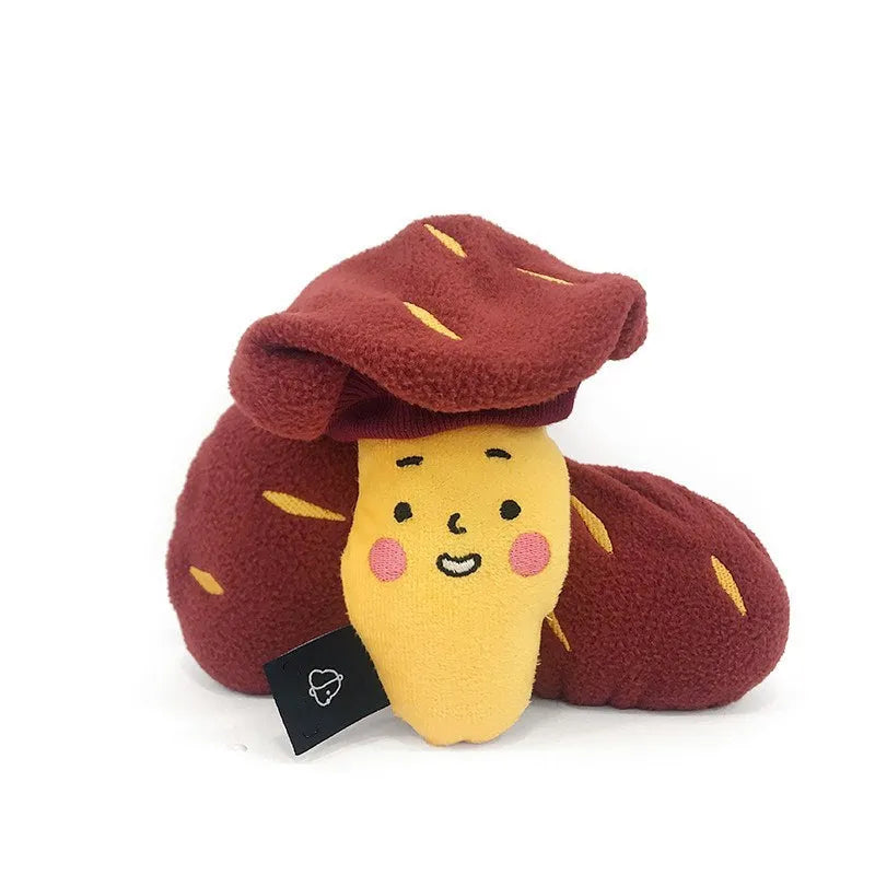 Red sweet potato-shaped dog toy with hidden food pockets and wrap-up design for treat puzzles.