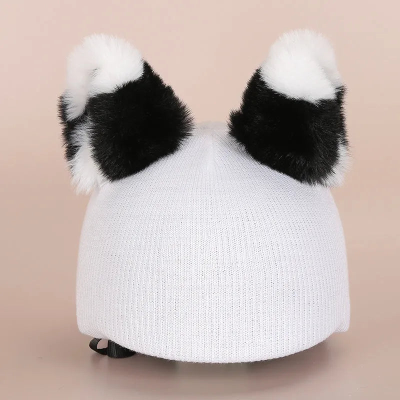 Cute cartoon ski helmet hat plush decoration in a selected colour style for winter theme display.