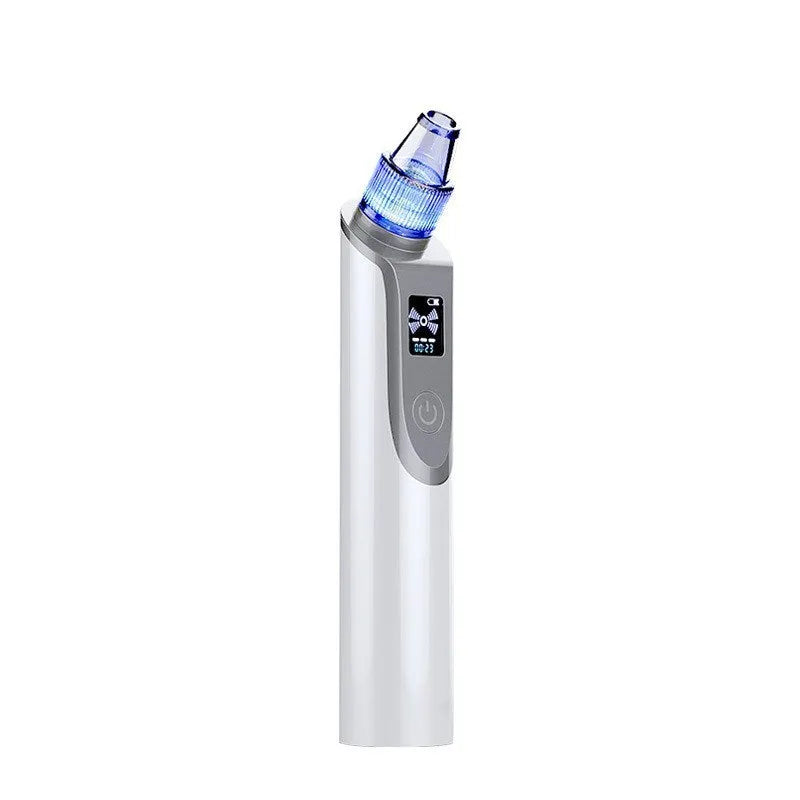 White handheld ultrasonic facial cleansing instrument with interchangeable suction heads on a clean surface.