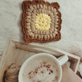 Crocheted wool cup placemat with Grandmother Lattice pattern in chosen colour