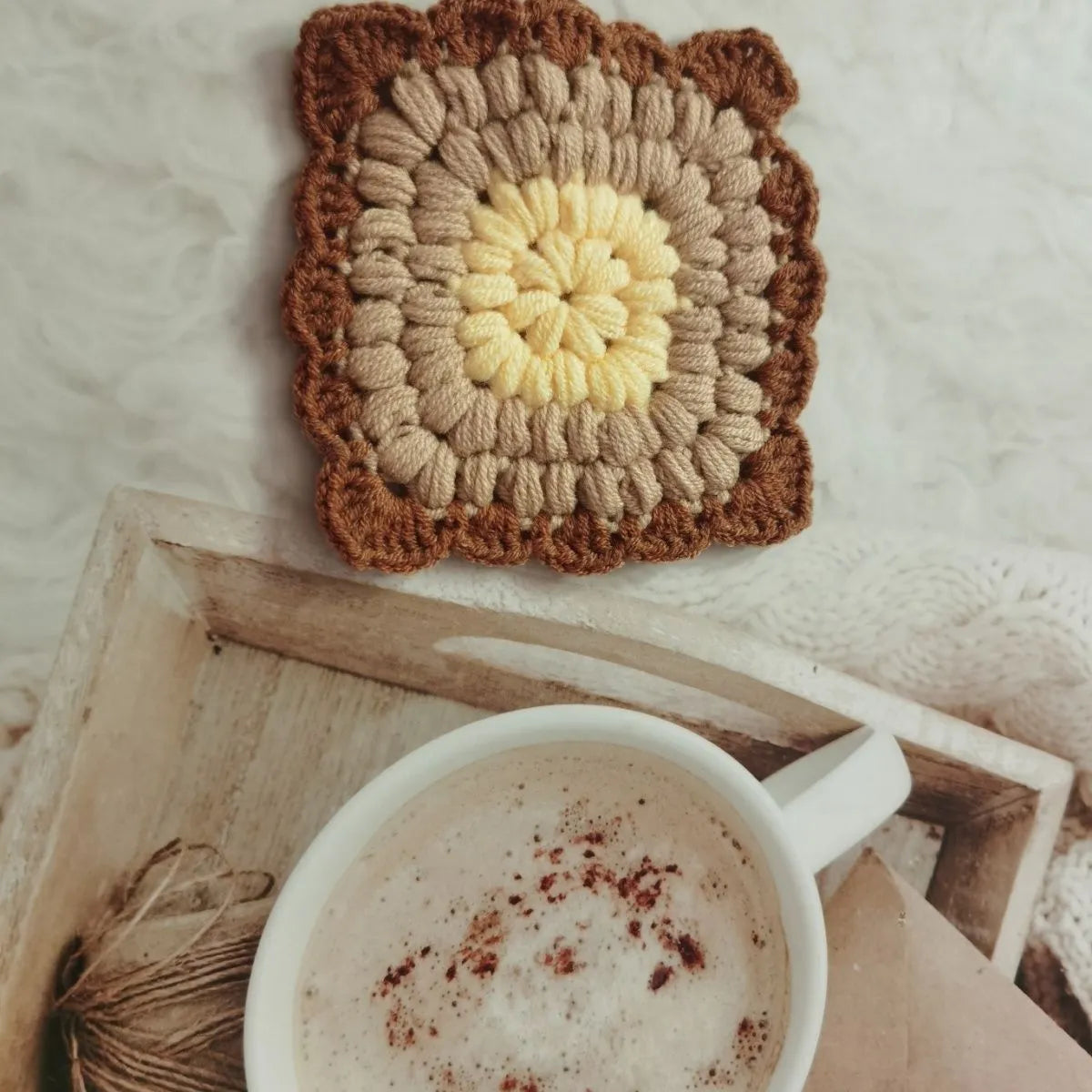 Crocheted wool cup placemat with Grandmother Lattice pattern in chosen colour
