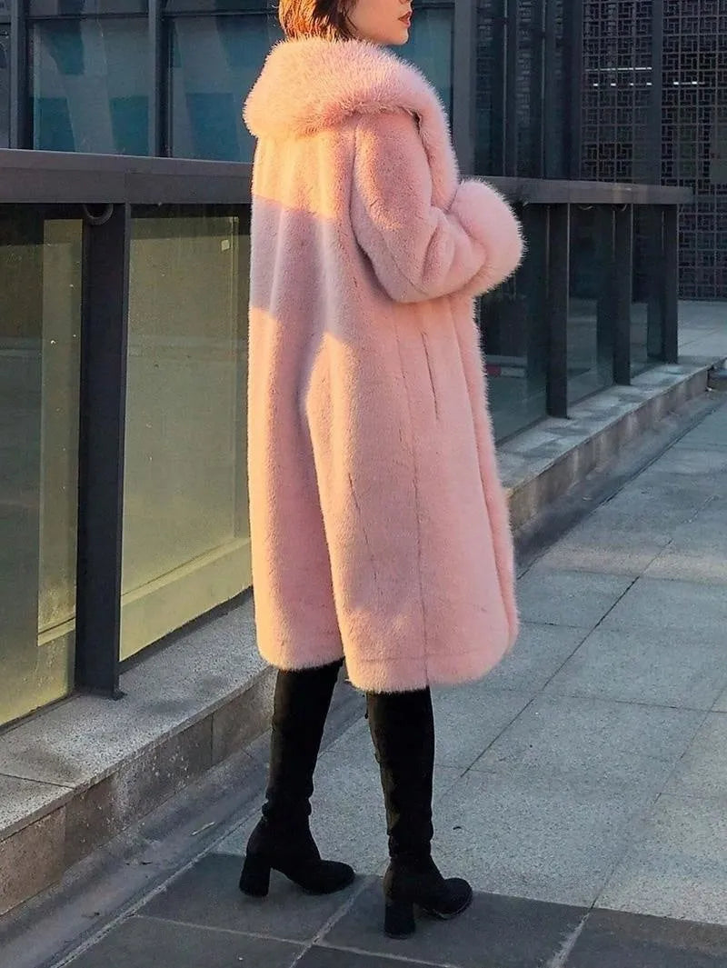 A grey women's mid-length faux fur coat with a fur collar and regular sleeves on a hanger.