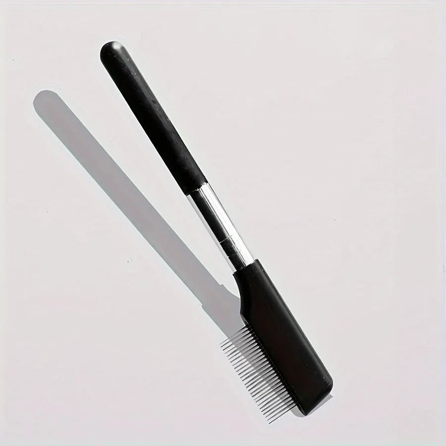 Black pet grooming brush with soft bristles for tear stain removal and comb attachment for dogs and cats