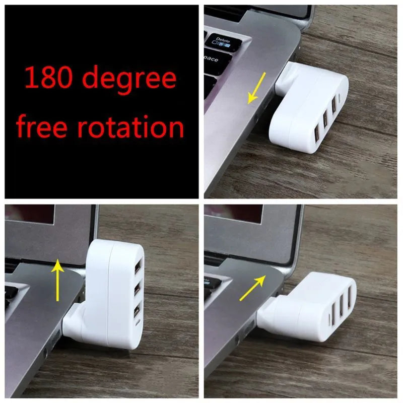 Black or white USB 2.0 four-port hub for laptop expansion on a desk.