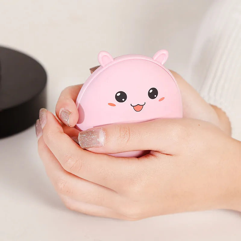 Compact multifunctional hand warmer in pink with aluminium alloy shell, 2600mAh power bank function