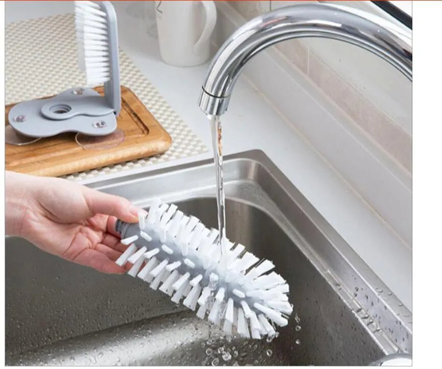 Grey rotating cup brush with suction cups for wall mounting and double cleaning heads