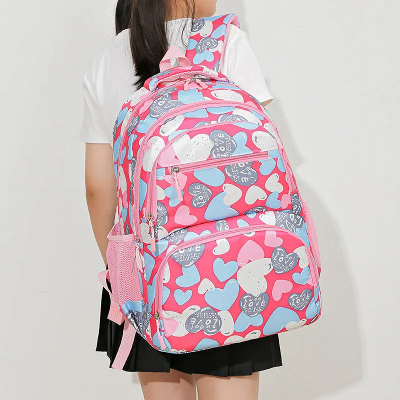 Blue children's large capacity Oxford cloth school backpack with air pillow straps.