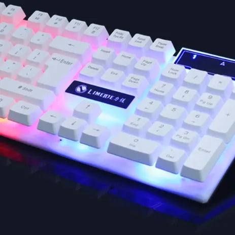 Wired gaming keyboard and mouse set with rainbow backlight and floating keys in black on a desk