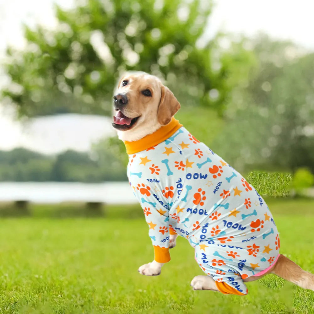 Cotton four-legged dog jumpsuit with colourful print design, shown on a small dog.