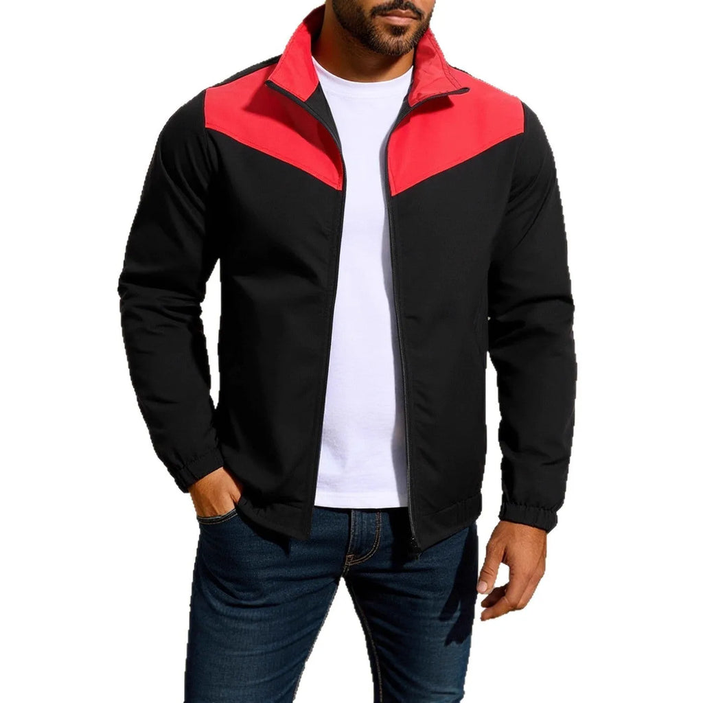 Men's green windproof jacket with high collar and matching zip, showing raglan sleeve construction.