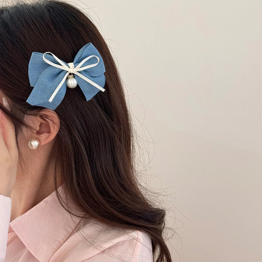Beige lace hair rope barrette with blue bow decoration and metal clip