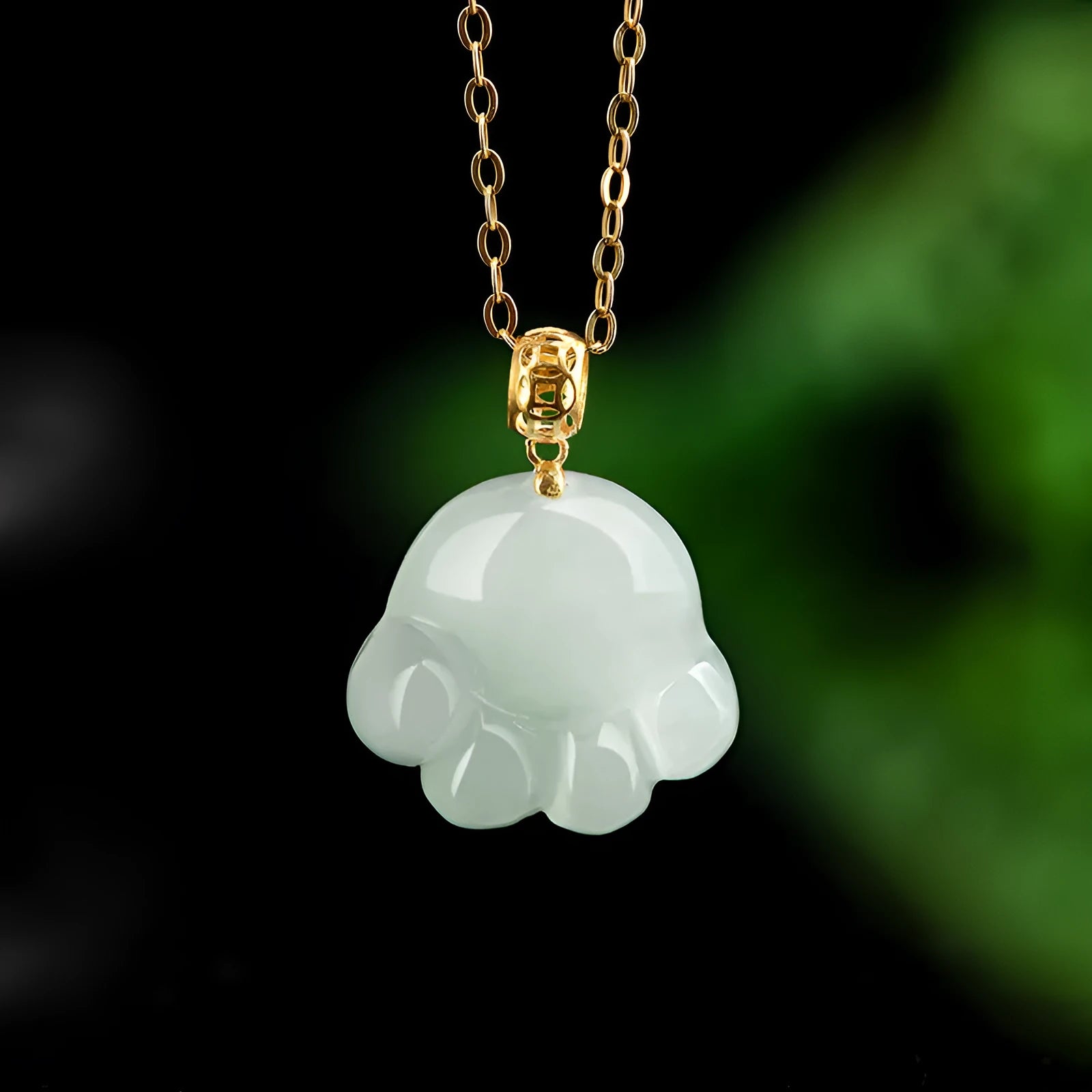 Emerald light green jade cat's paw pendant with 18K gold buckle and certificate on a white background