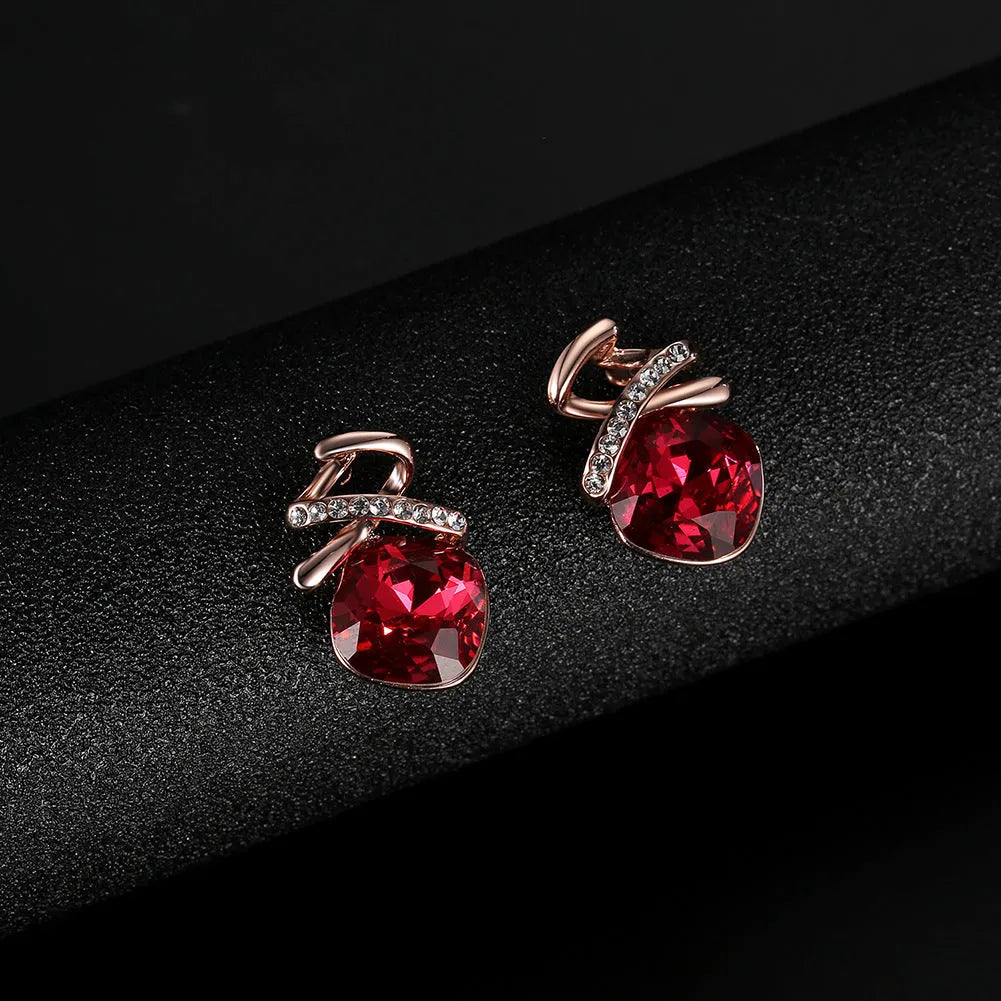 Women's alloy necklace and earring set with water wave chain and diamond-like detail on a white background.