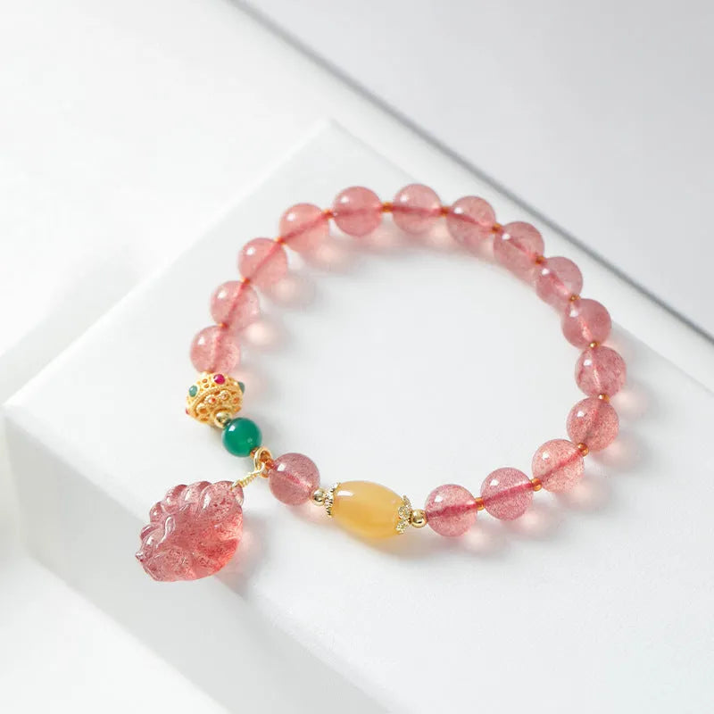 Women's crystal bracelet with polished strawberry quartz beads in nine tail fox colour design