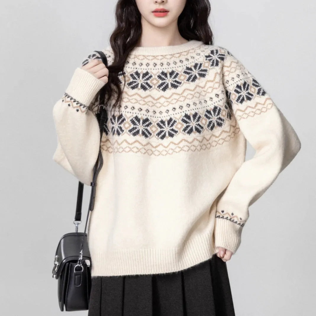 Women's milky white fair isle geometric pattern knit pullover sweater on a hanger.