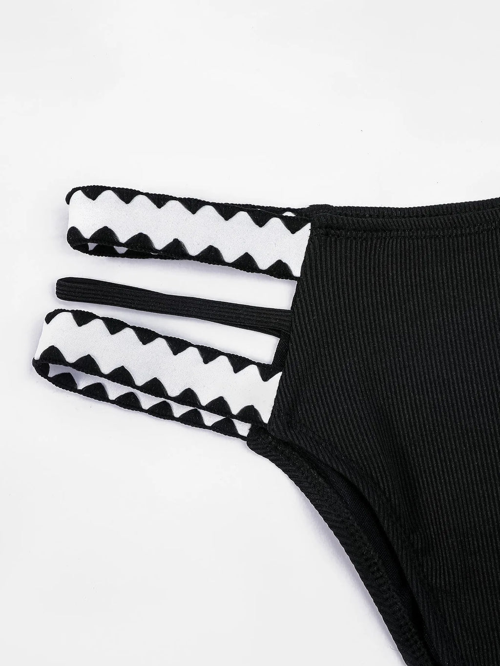 Black women's one-piece swimsuit with hollowed-out split design and briefs cut.
