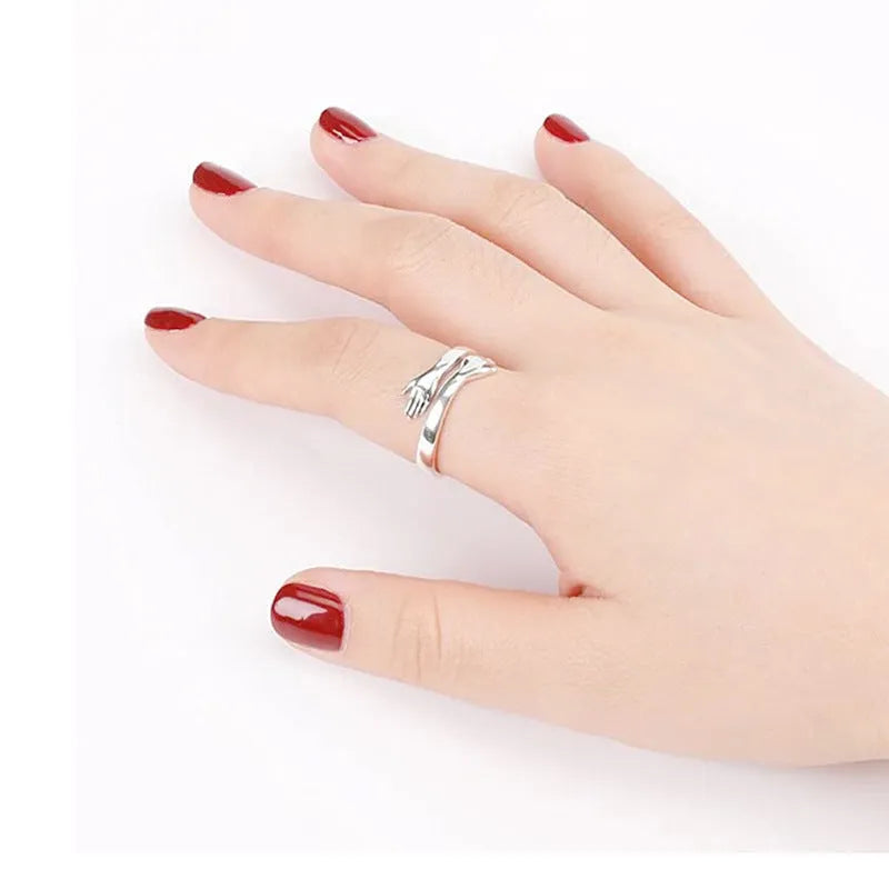 Geometric titanium steel ring with stamping finish in silver colour on a neutral background