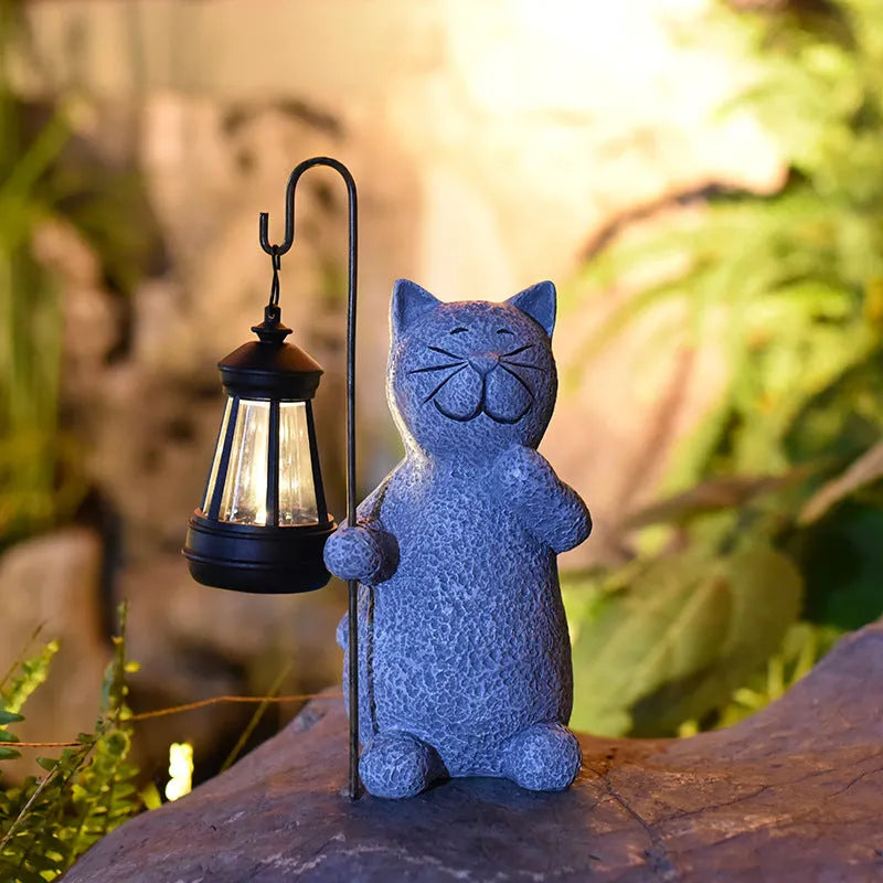 Pastoral style resin solar garden lamp with kitten lifting design for outdoor decoration