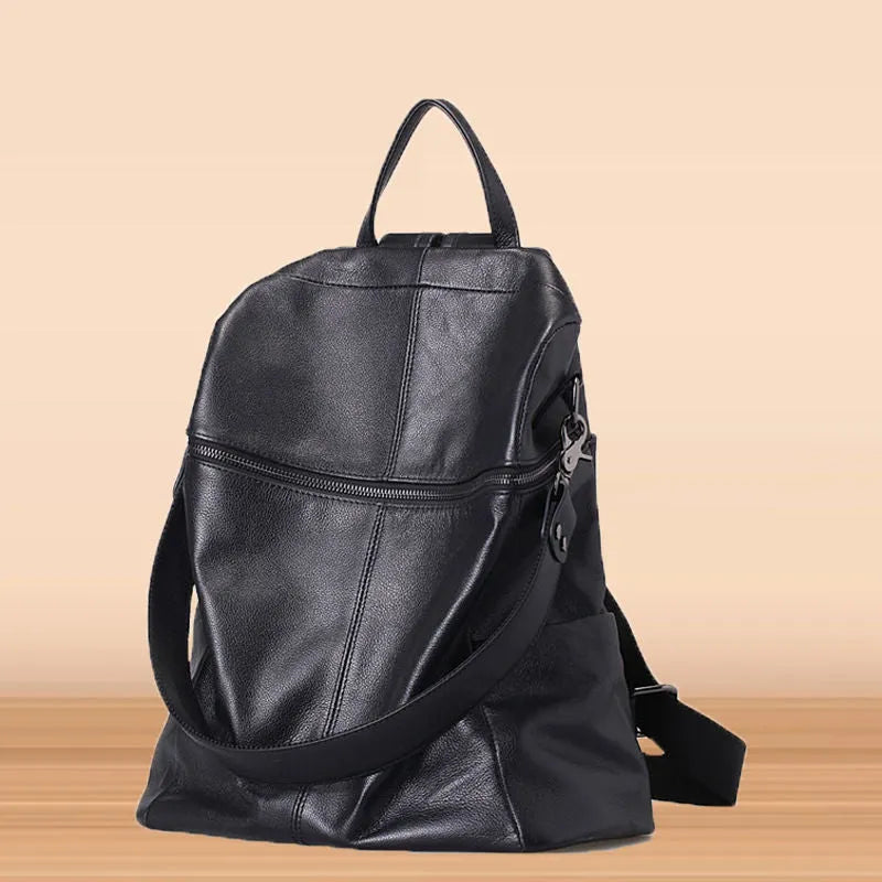 Genuine leather women's retro backpack showing sewing thread details and sandwich pocket