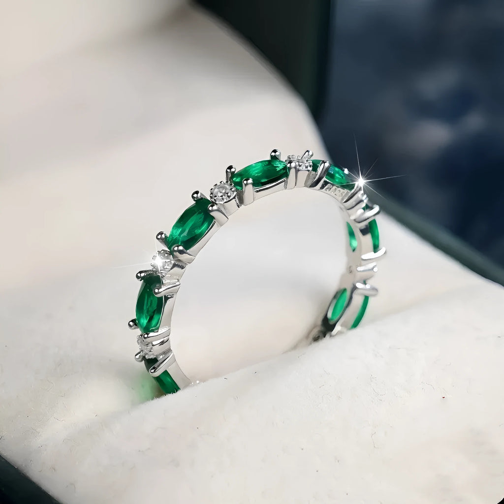 Copper ring with green and white zircon inlay geometric design on finger