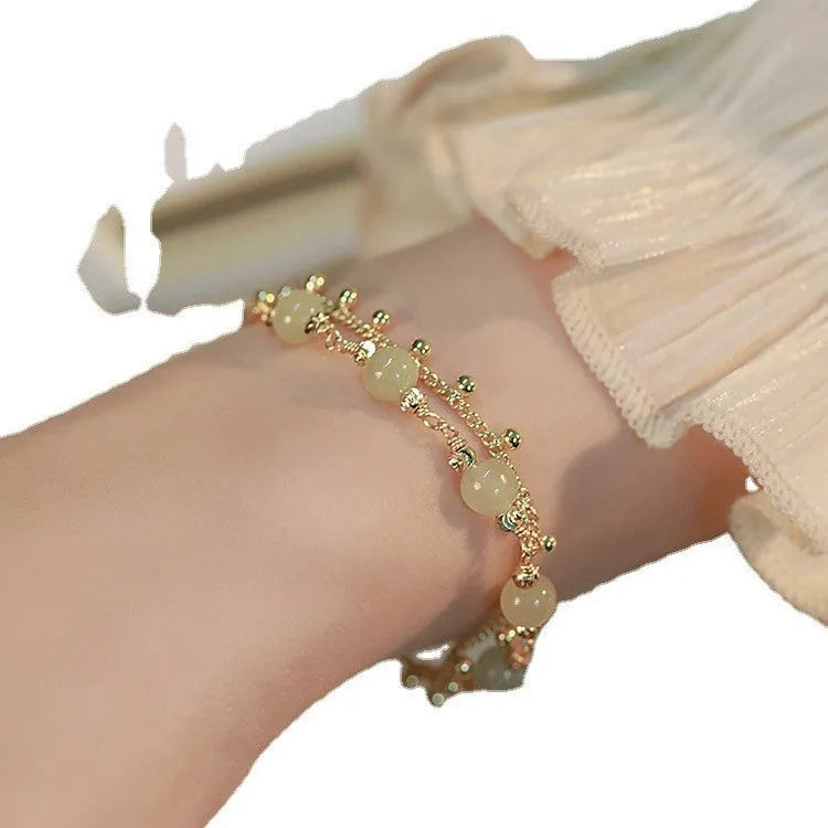 Natural Hetian Jade bracelet with princess running beaded design for women