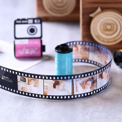 Kodak yellow wooden memory colour film album boxes stacked with a tote bag
