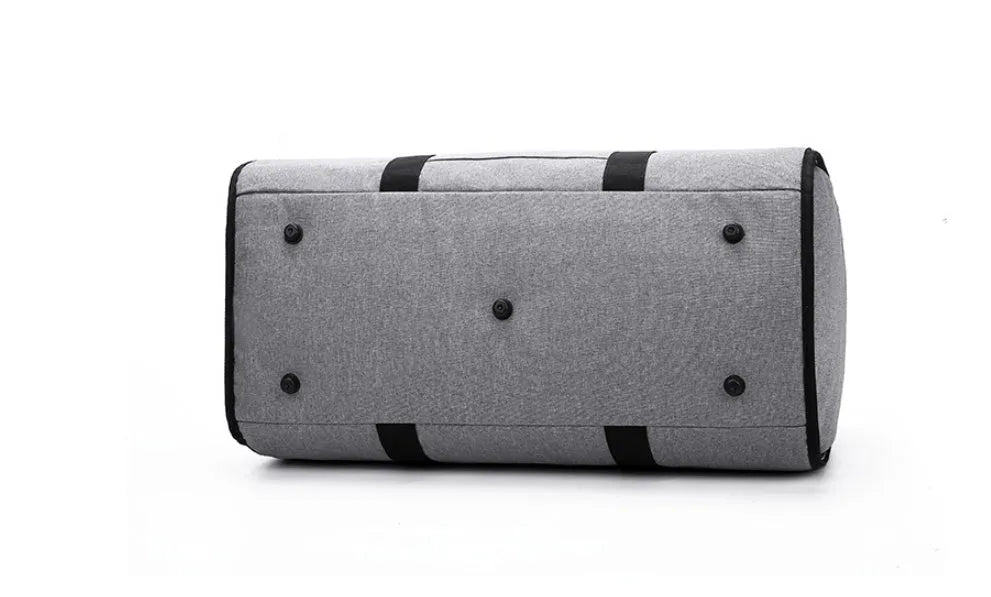 Medium cylindrical travel bag in waterproof Oxford cloth, shown in red with zipper pocket open.