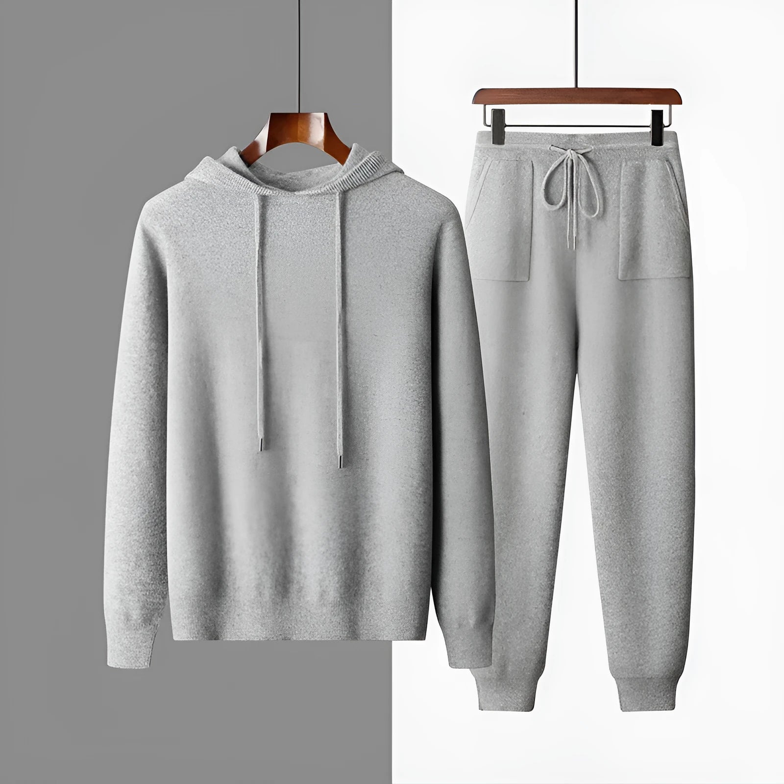 Men's light grey cashmere hoodie and matching trousers casual set laid flat.