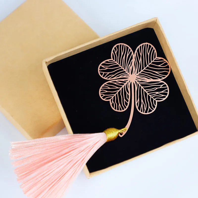 Brass electroplated metal bookmark with hollow-out leaf design and rose gold tassel