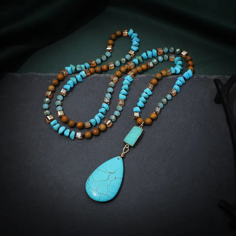 Blue turquoise heart and water drop shape pendant necklace with mixed gem inlay on a ball bead chain.