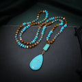 Blue turquoise heart and water drop shape pendant necklace with mixed gem inlay on a ball bead chain.