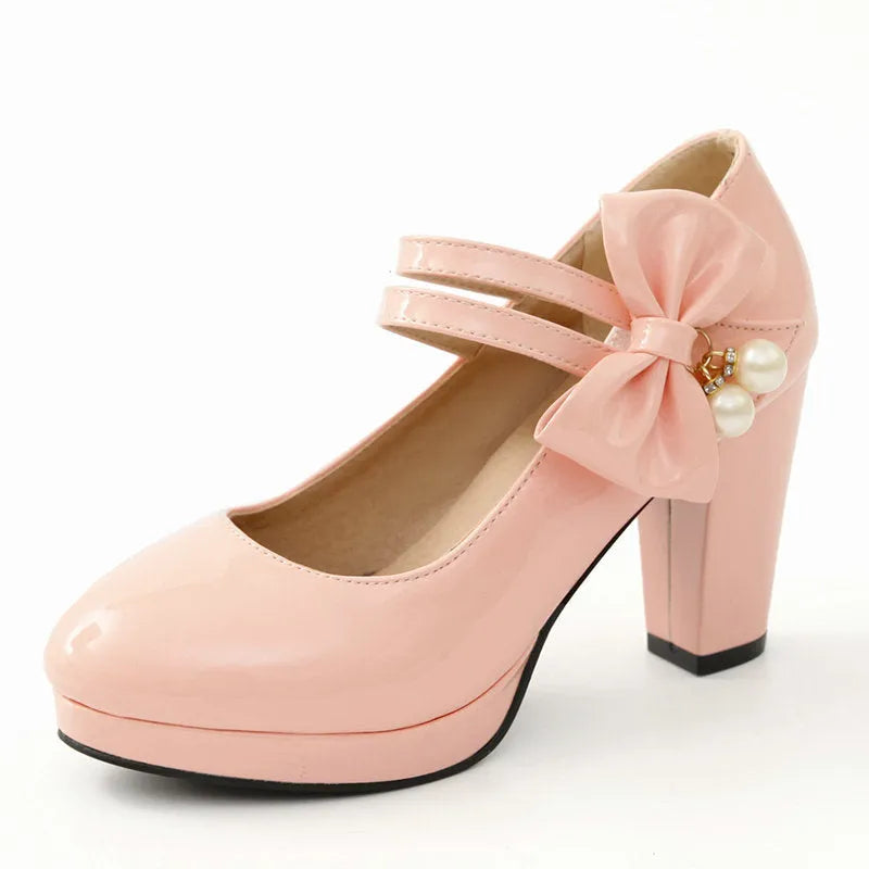 Red platform shoes with chunky heels, round toes, and buckle fastening on waterproof rubber soles
