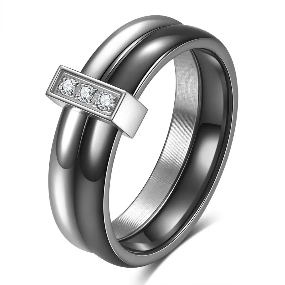 Close-up of a women's geometric ceramic ring with a 6mm wide band and glossy stitching detail, shown in a gold white electroplated finish.