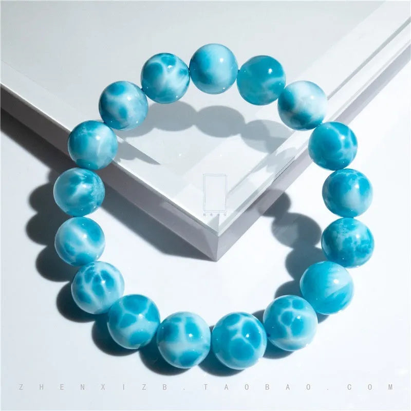 Blue manually crafted Bodhi bracelet with sea-pattern crystal stones and pearl details.