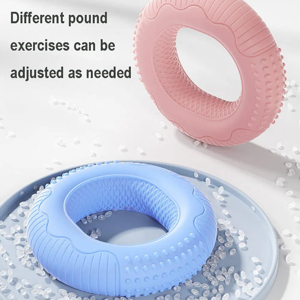 Silicone hand grip ring in five colours showing textured surface and compact 7.4cm size for finger and forearm strength training
