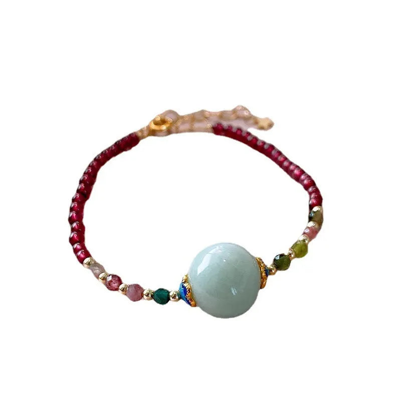 Women's aquamarine and garnet bracelet with drop shape stones and electroplated tourmaline elements