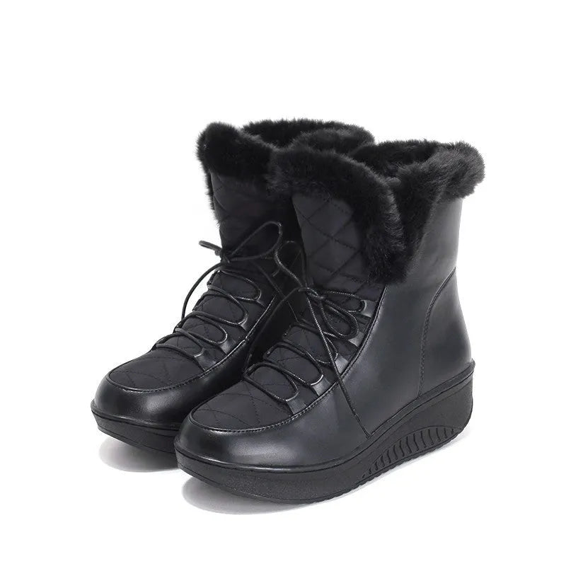 Black lace-up women's winter boots with a platform heel and plush lining on a white background.