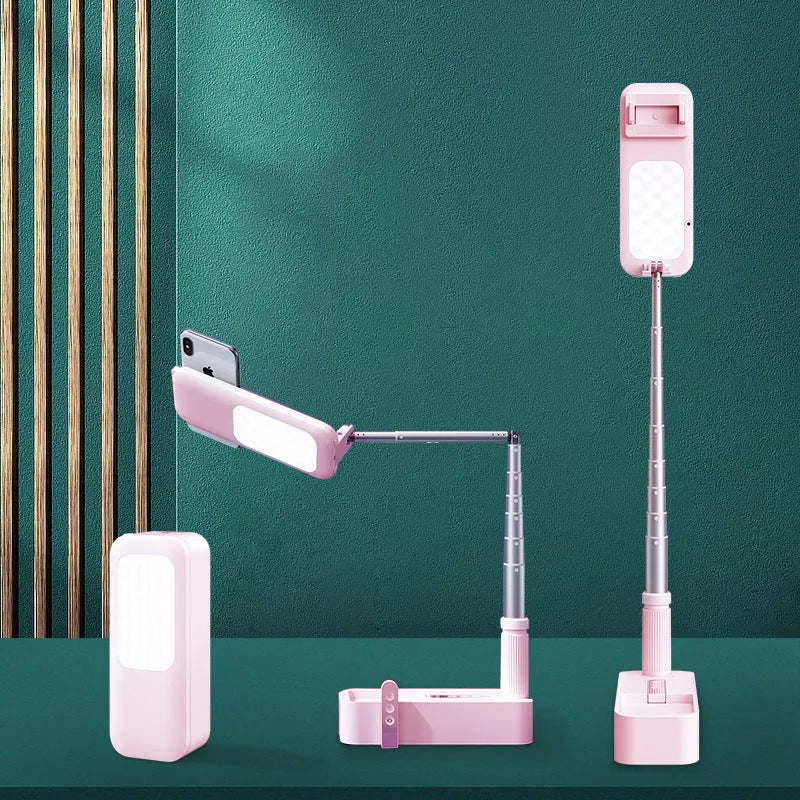 White wireless retractable fill light bracket for smartphone on a desk with LED lighting