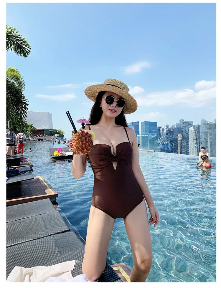 Women's solid colour one-piece swimsuit with push-up padding and spaghetti straps