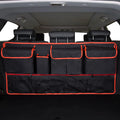 Car boot hanging storage bag made from black Oxford cloth with red piping and handle