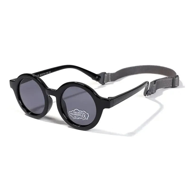 Children's silicone sunglasses for 0-3 year olds with round frame and polarized lenses in multiple colour options