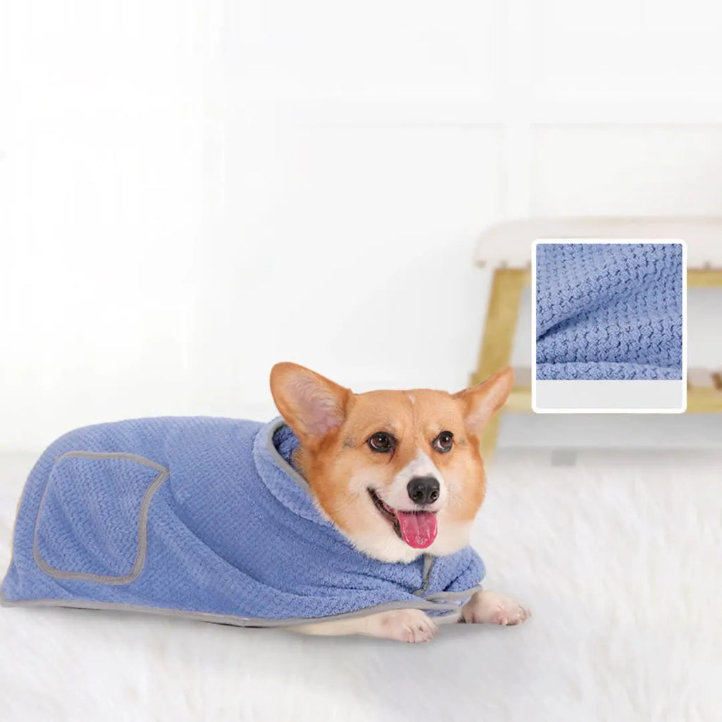 A blue dog bath robe towel with an adjustable waistband wrapped around a dog, showing the snap button closure.