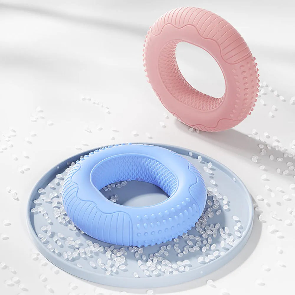 Silicone hand grip ring in five colours showing textured surface and compact 7.4cm size for finger and forearm strength training