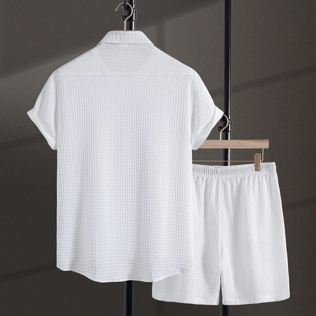 Men's loose fit cotton blend beach shorts suit in black, showing short sleeve shirt and matching shorts.