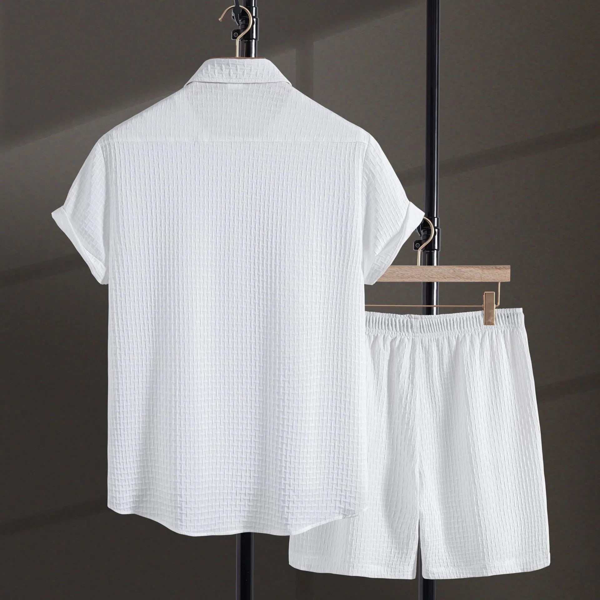 Men's loose fit cotton blend beach shorts suit in black, showing short sleeve shirt and matching shorts.