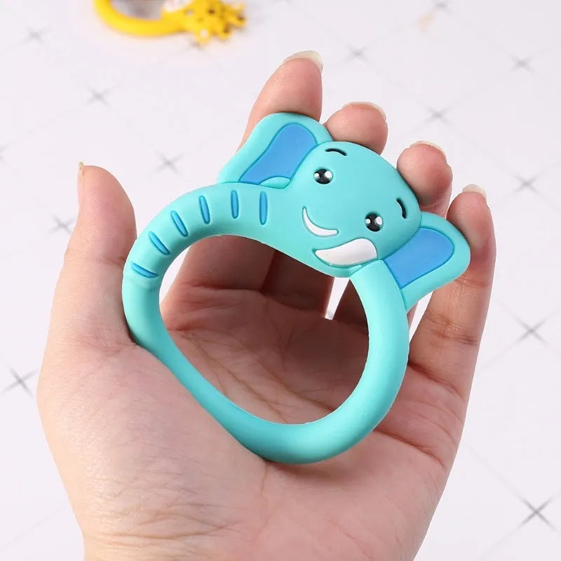 Three baby molar silicone teethers in brown, blue, and yellow on a white background